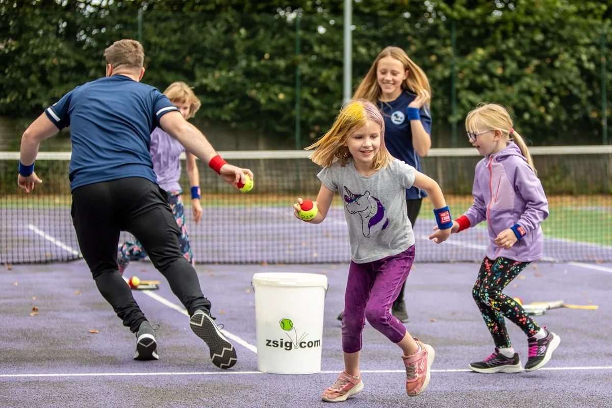 Children enjoying a fun and inclusive MH Tennis junior session