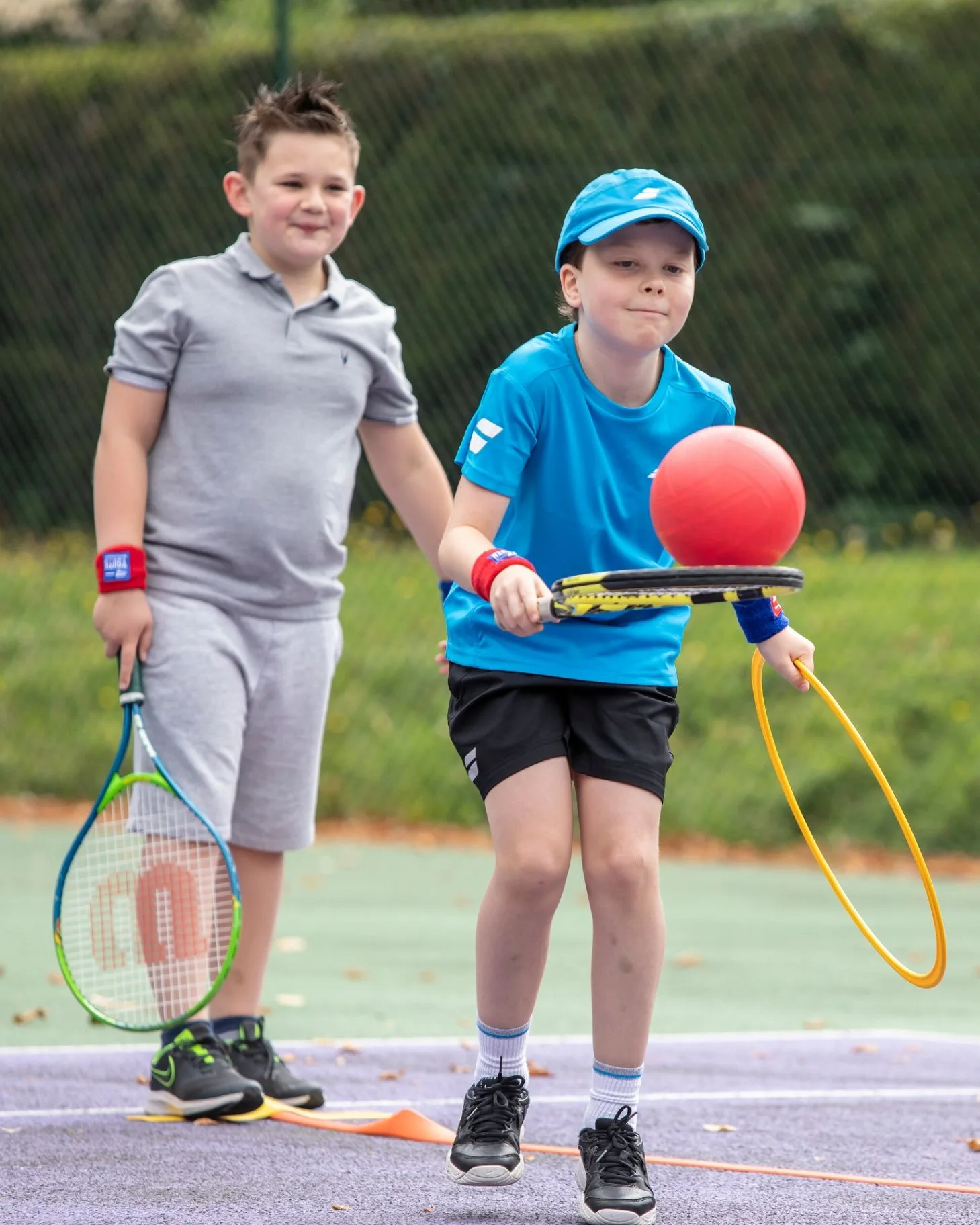 Young players taking part in a player-centred MH Tennis coaching activity