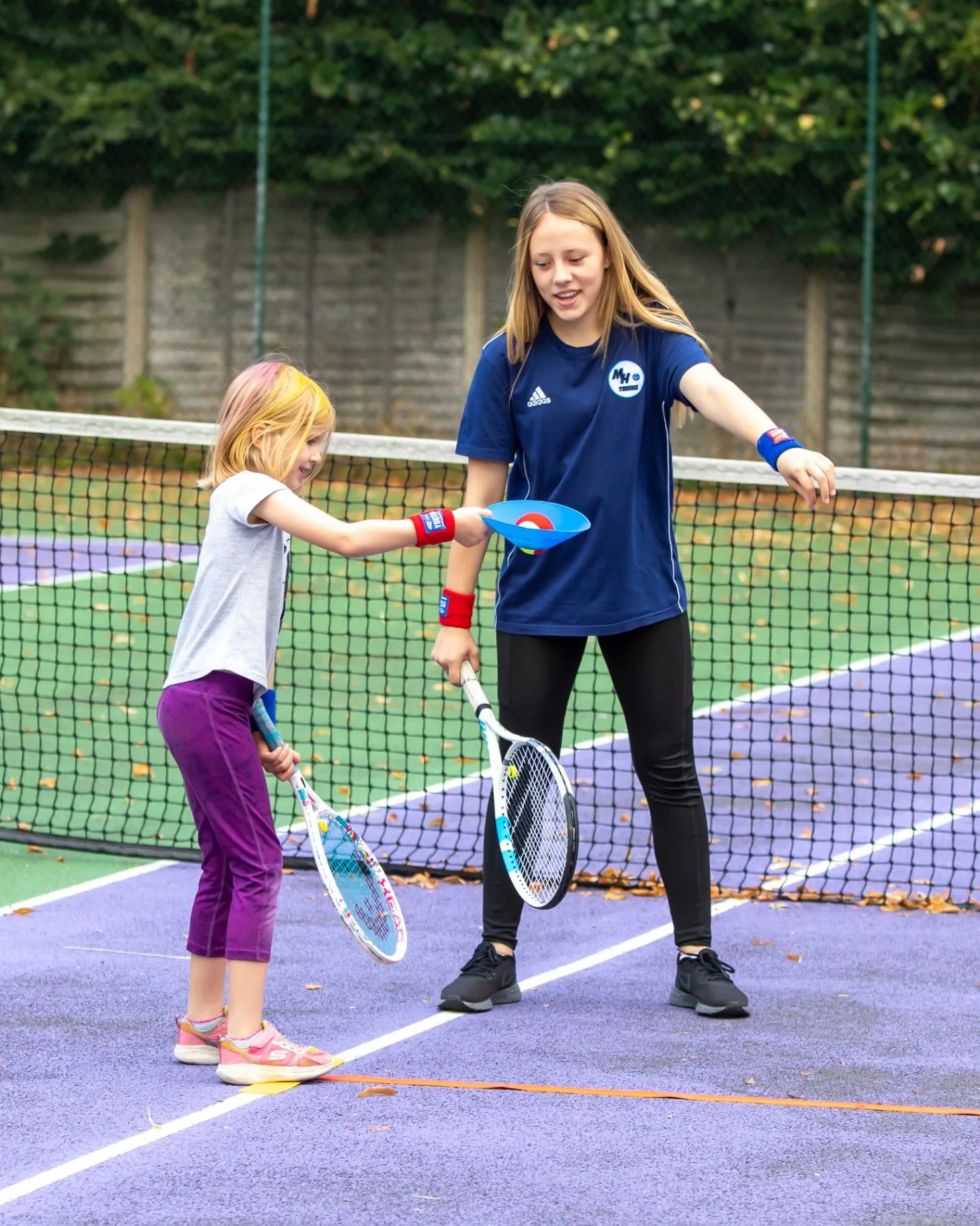 Children enjoying the social side of LTA Youth tennis at MH Tennis