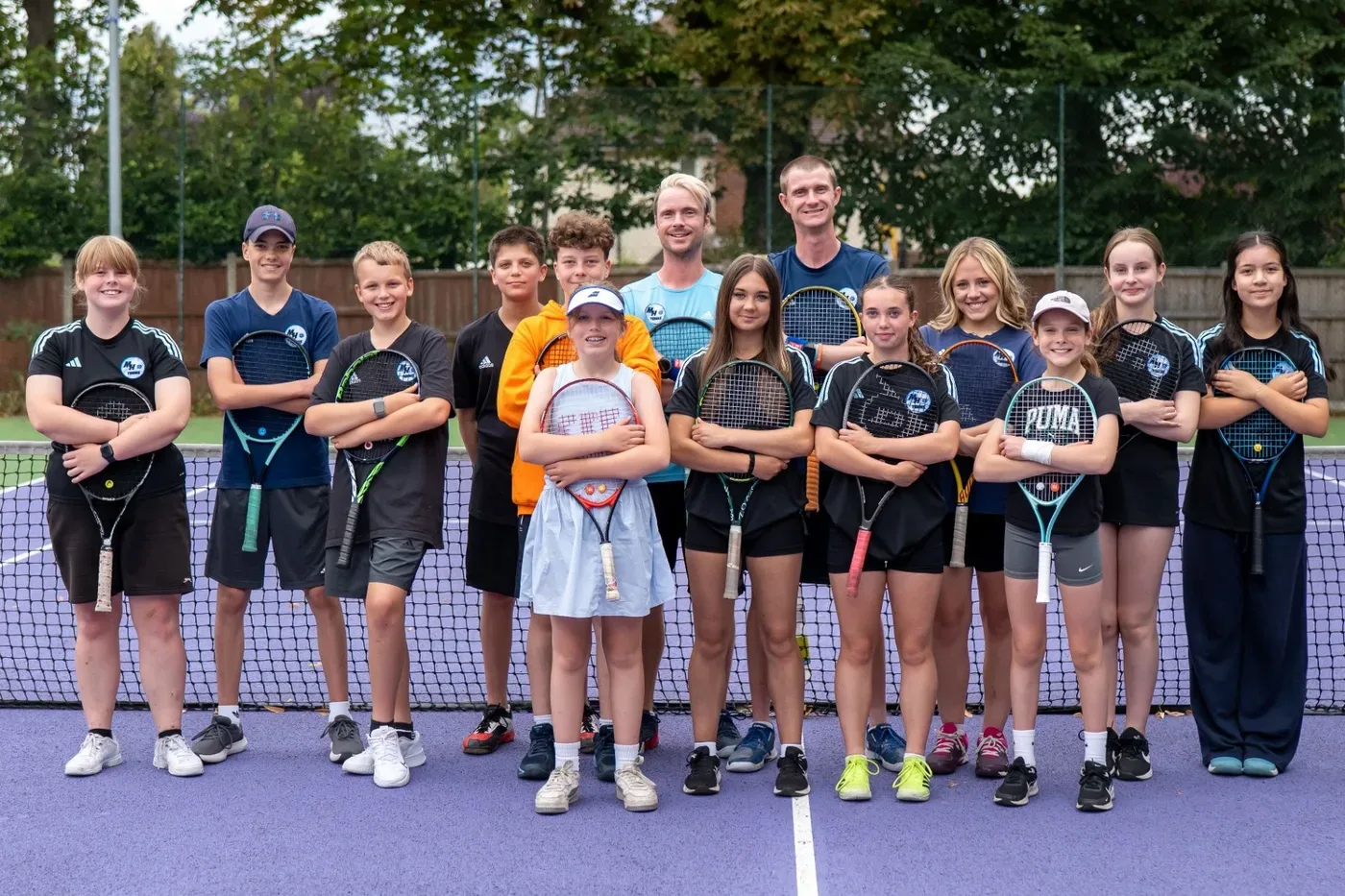MH Tennis players lined up together at the net