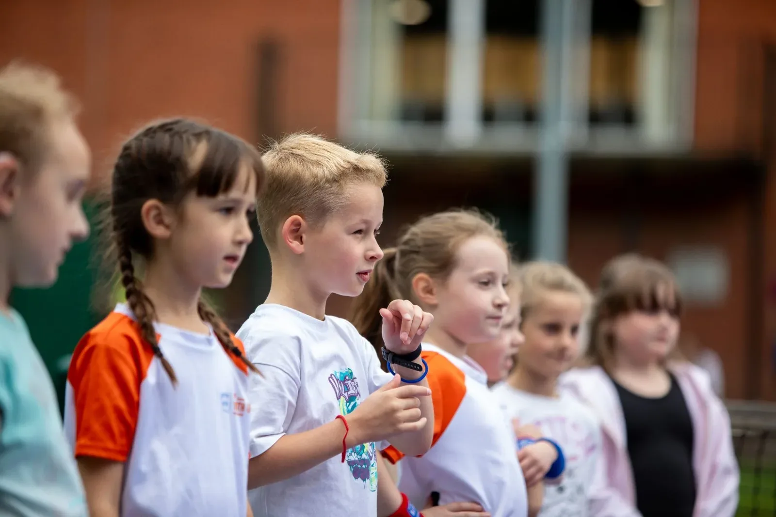Young players watching a coaching demonstration